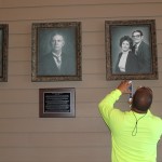 the installation of the pictures and plaques