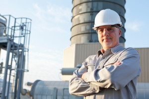 Engineer wearing hardhat at industrial facility